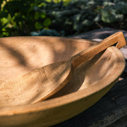 Antique wooden butter bowl with paddle